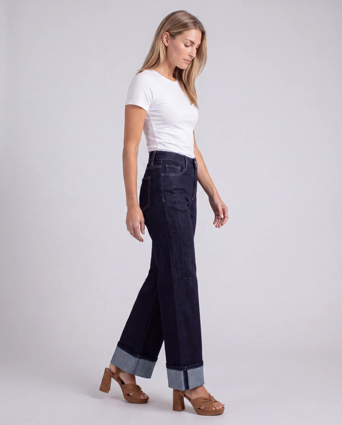 Ainsley High-Rise Wide-Leg Cuffed Jeans – Dark Wash, walking three-quarter view