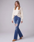 Selene High-Rise Flared Jeans, walking three-quarter view