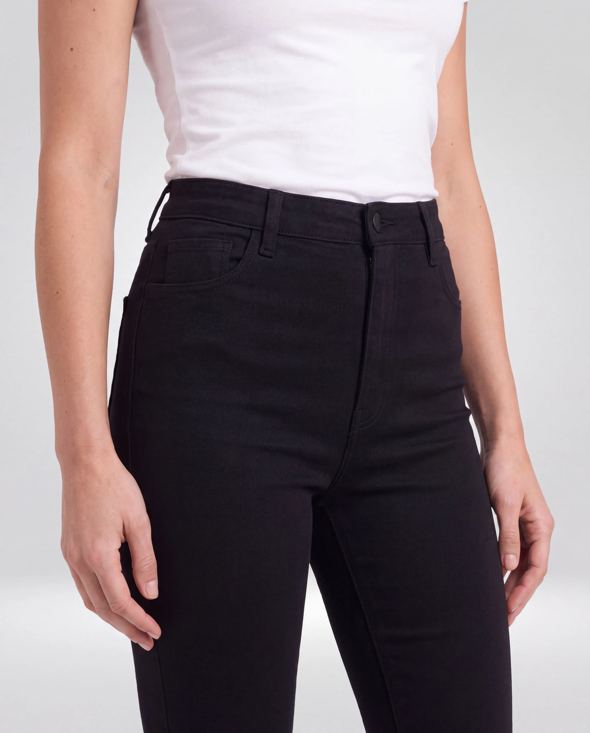Marlow High-Waisted Flared Jeans – Black, waist and pocket detail