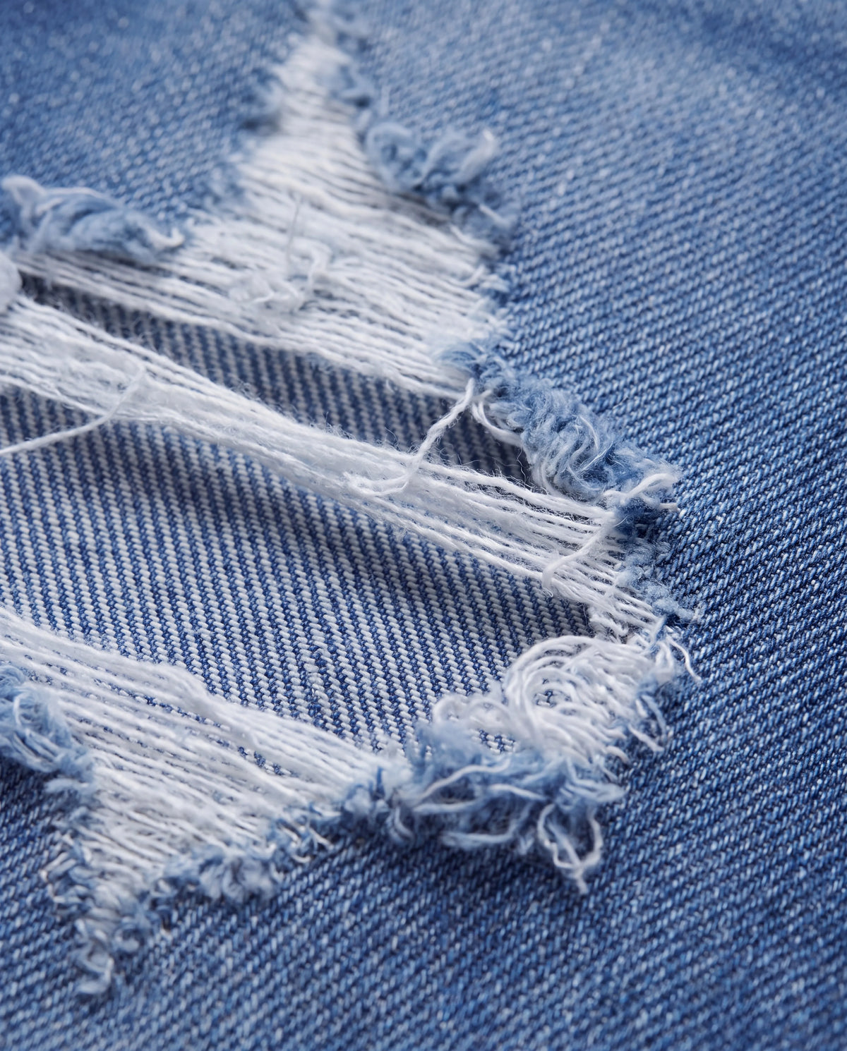Selene High-Rise Flared Jeans, distressed denim detail