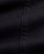 Marlow High-Waisted Flared Jeans – Black, black fabric and seam detail