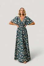 Mirelle Shirred V-Neck Maxi Dress, in slate floral, front view with hands at waist