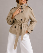 Women's Cropped Trench Coat Jacket with Belt, Stand Collar and Epaulettes in Beige – Nina