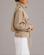 Women's Cropped Trench Coat Jacket with Belt, Stand Collar and Epaulettes in Beige – Nina